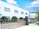 At the gate of the factory